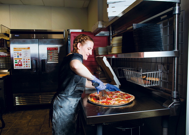 A new expediting station is the last stop for pizzas before they go out to the customers.