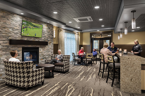 Onsite pub and apts int clubhouse bar w people